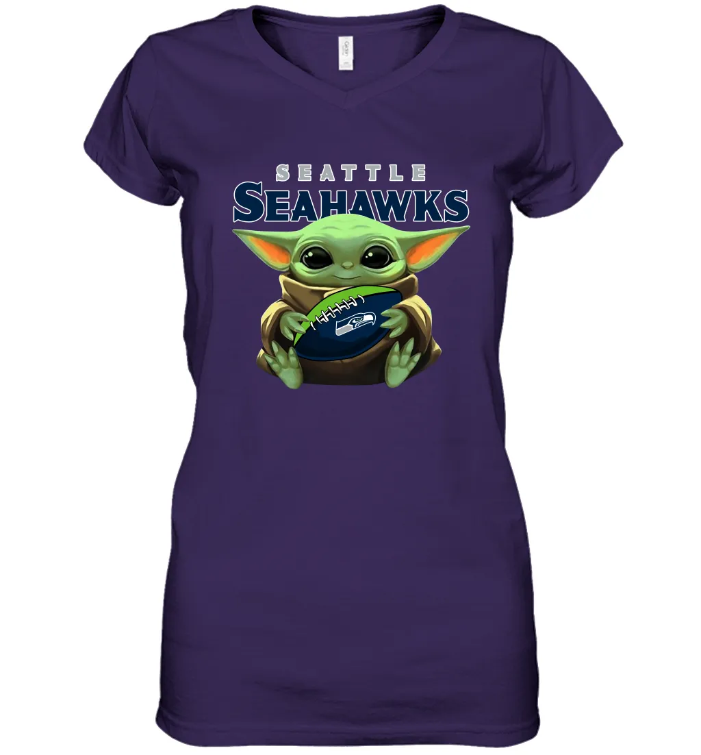 Baby Yoda Loves The Seattle Seahawks Star Wars Baby Yoda Hugs Seahawks NFL Womens V-Neck T-Shirt