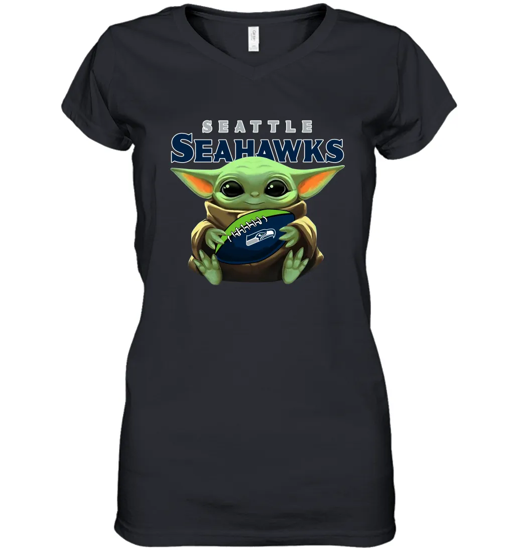 Baby Yoda Loves The Seattle Seahawks Star Wars Baby Yoda Hugs Seahawks NFL Womens V-Neck T-Shirt